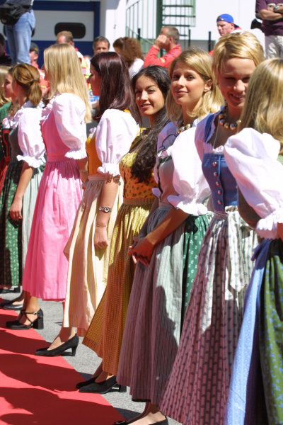 Grid girls in traditional costume at the Austrian Grand Prix in Zeltweg on 11-13 May 2001. 