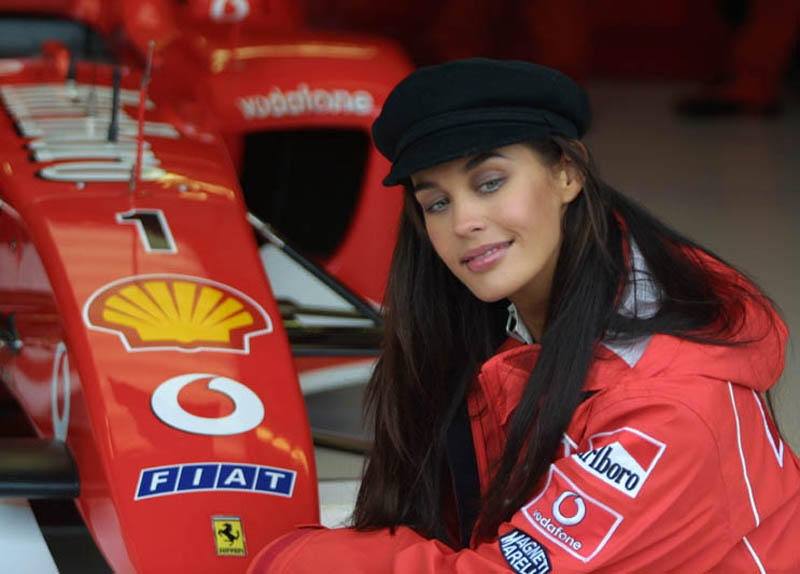 Model Megan Gale and a Ferrari at the Australian Grand Prix at the Melbourne Grand Prix Circuit on 09 March 2003.