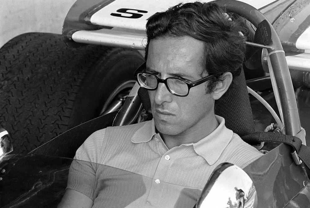 Mauro Forghieri in a Ferrari race car.