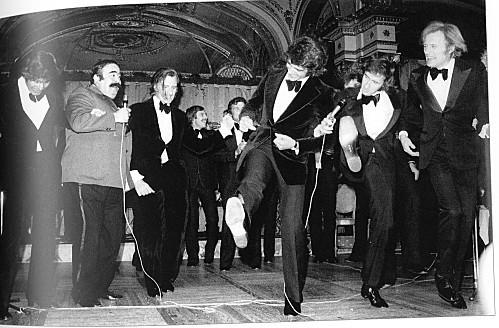 Francois Cevert and Jackie Stewart dancing.