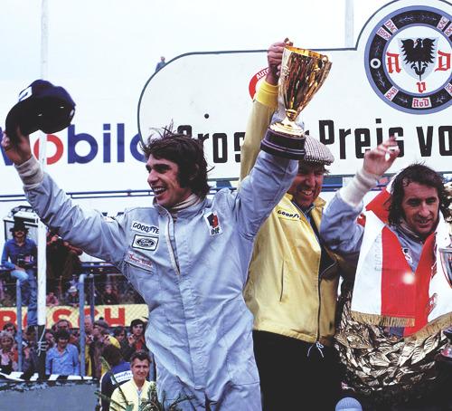 Francois Cevert, Ken Tyrrell and Jackie Stewart.