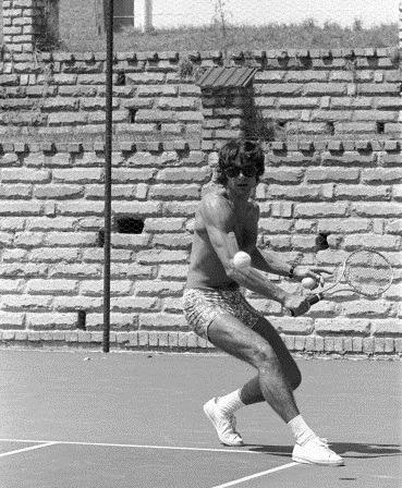 Francois Cevert playing tennis.