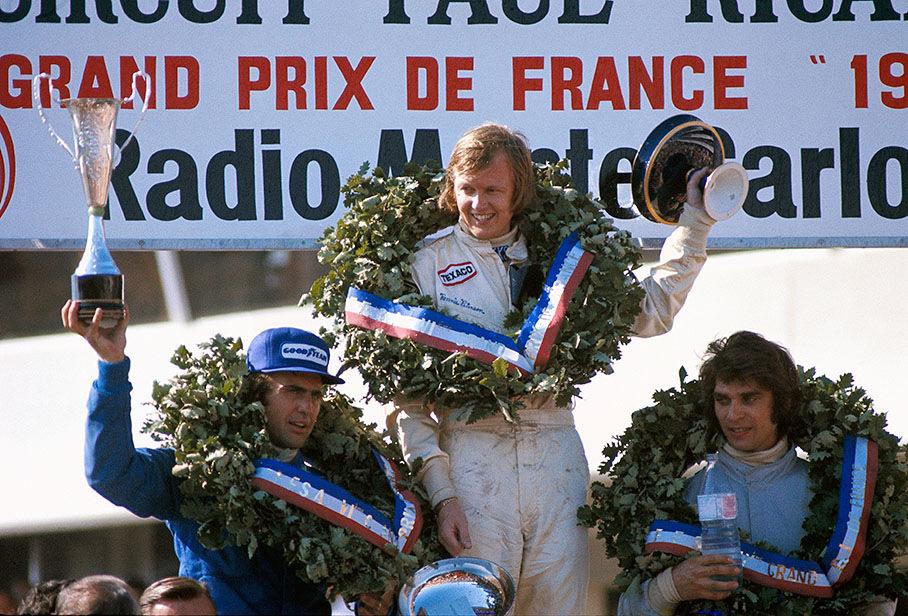 Ronnie Peterson, Francois Cevert and Carlos Reutemann celebrating on the podium at Le Castellet, France, on July 01, 1973.