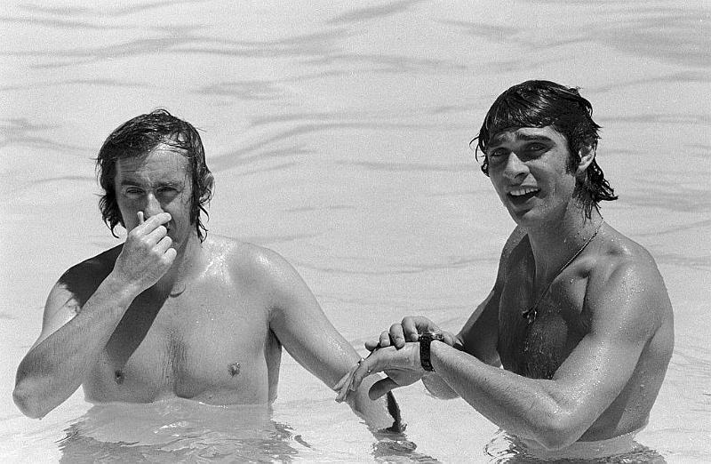 Jackie Stewart and Francois Cevert in a pool.