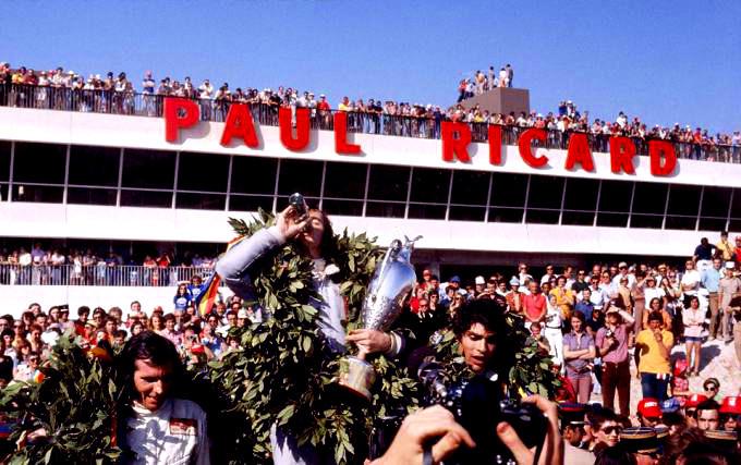 Francois Cevert on the podium at Paul Ricard with Jackie Stewart and Emerson Fittipaldi.