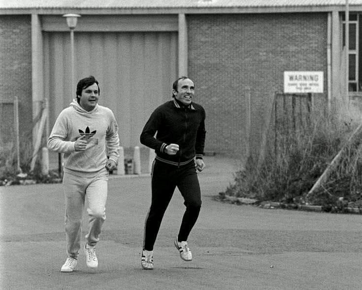 Frank Williams doing jogging with Alan Jones.