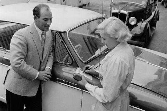 Stirling Moss with a woman