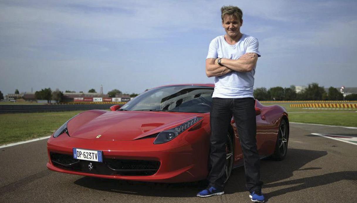 Gordon Ramsay with a red Ferrari