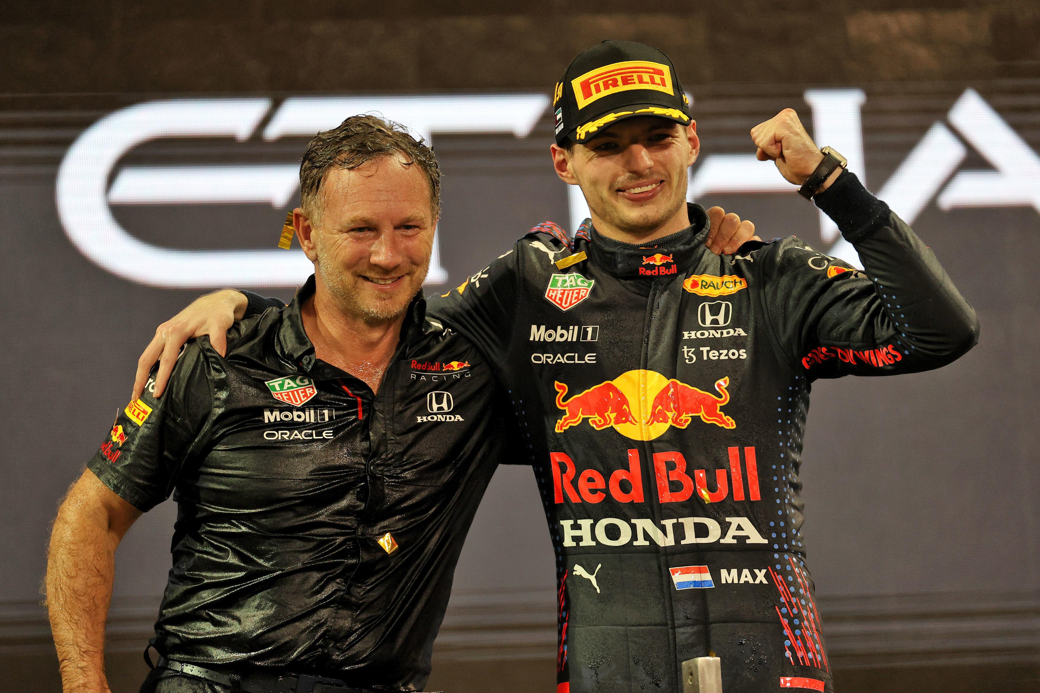 Chris Horner and Max Verstappen celebrate winning the 2021 world championship.