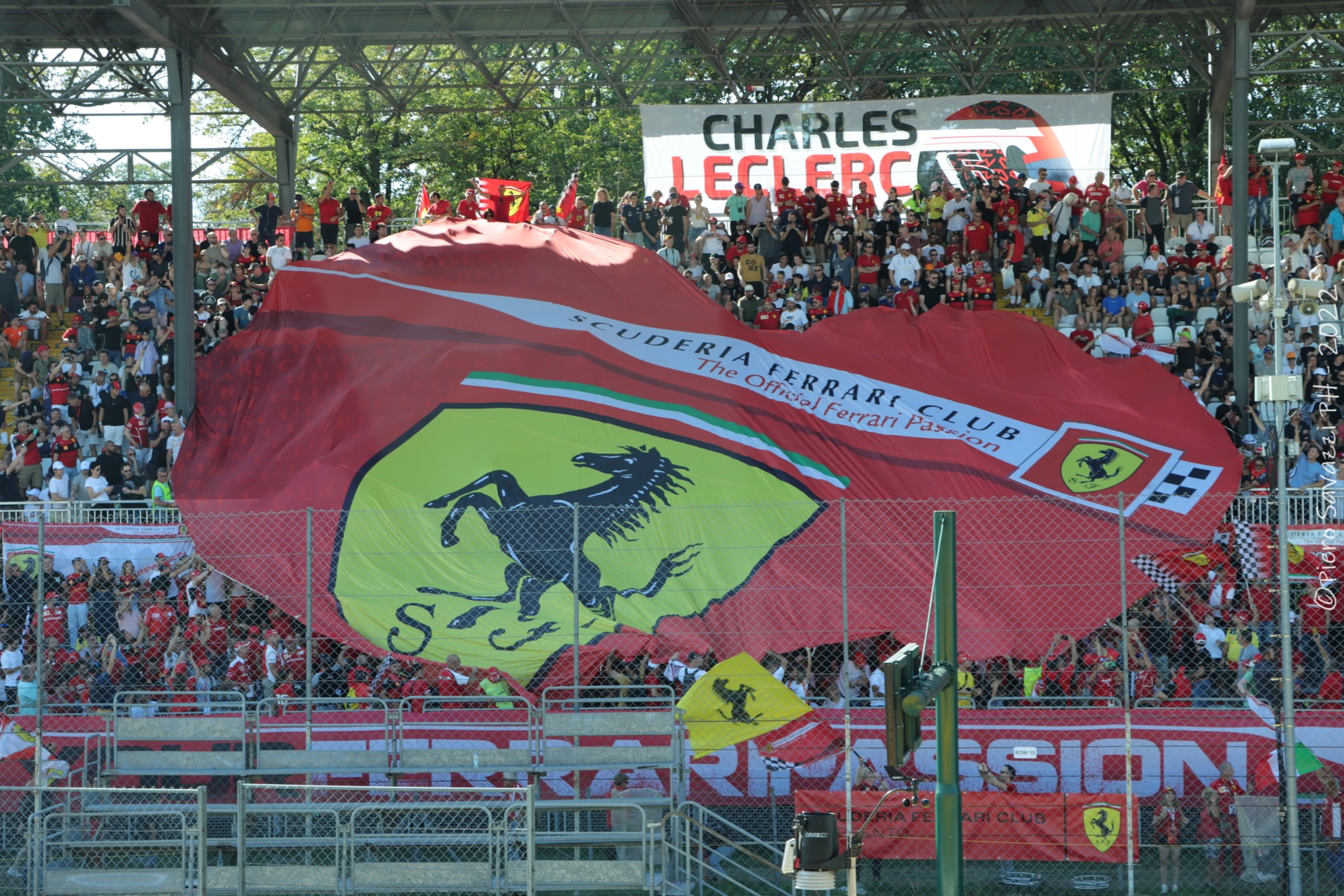 Scuderia Ferrari Club fans with their big red heart-shaped flag. 