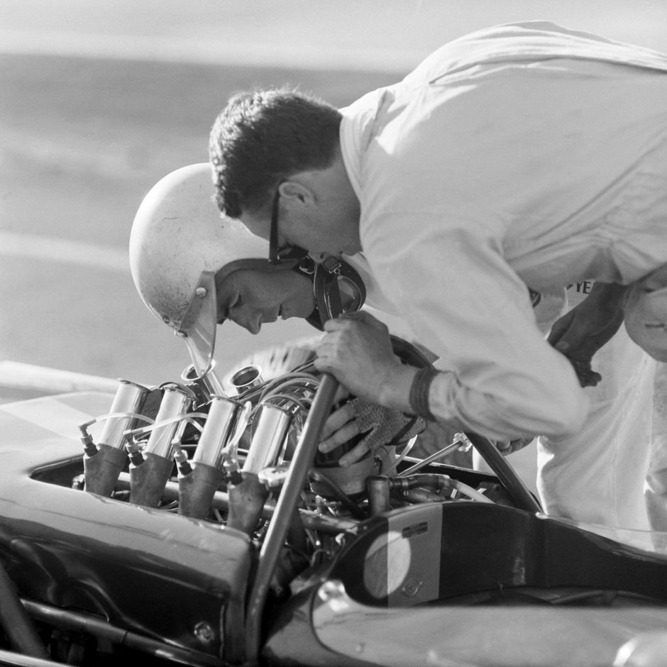 Jack Brabham checks his Repco Brabham engine before the start of an international event at Surfers Paradise, date unknown.