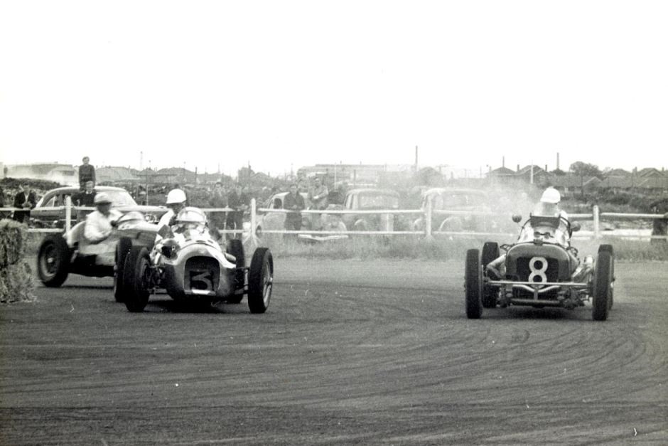 Jack Brabham (back), in a Cooper Bristol, races against LtoR Lex Davison in a H W M Jaguar and Ted Gray in an Alta Ford race for the Victoria Trophy at Fisherman's Bend, Victoria, on March 22, 1954.