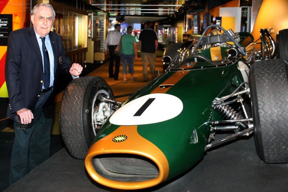 Sir Jack Brabham stands next to his Repco Brabham BT19 when it was on display at the National Sport Museum at the MCG, January 2010.