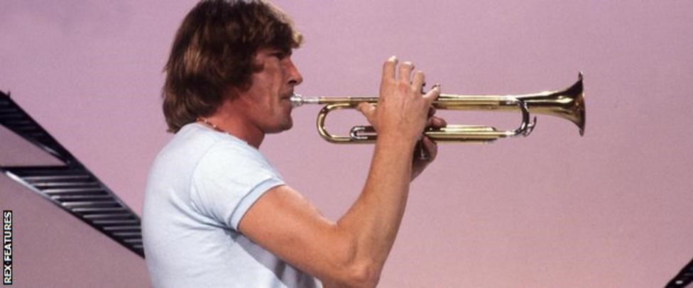 James Hunt playing the trumpet.