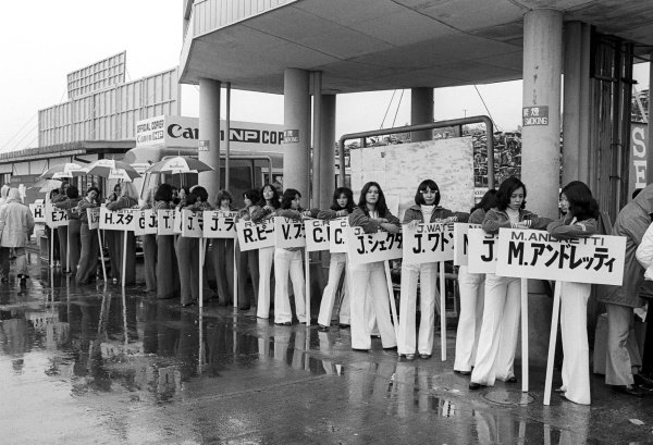 The grid girls assemble in the paddock at the Japanese Grand Prix on 24 October 1976.