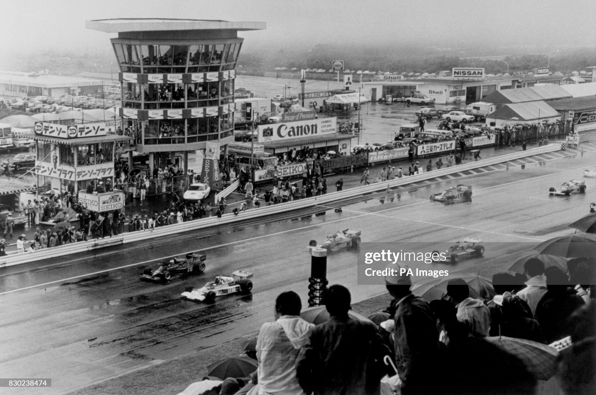 James Hunt in a McLaren and Mario Andretti in a Lotus lead the way during the Japanese Grand Prix at Fuji on 28 October 1976. 