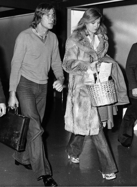 James Hunt with girlfriend Jane Birbeck at Heathrow Airport after returning from Canada where Hunt punched a Grand Prix official after crashing his car in 1977.
