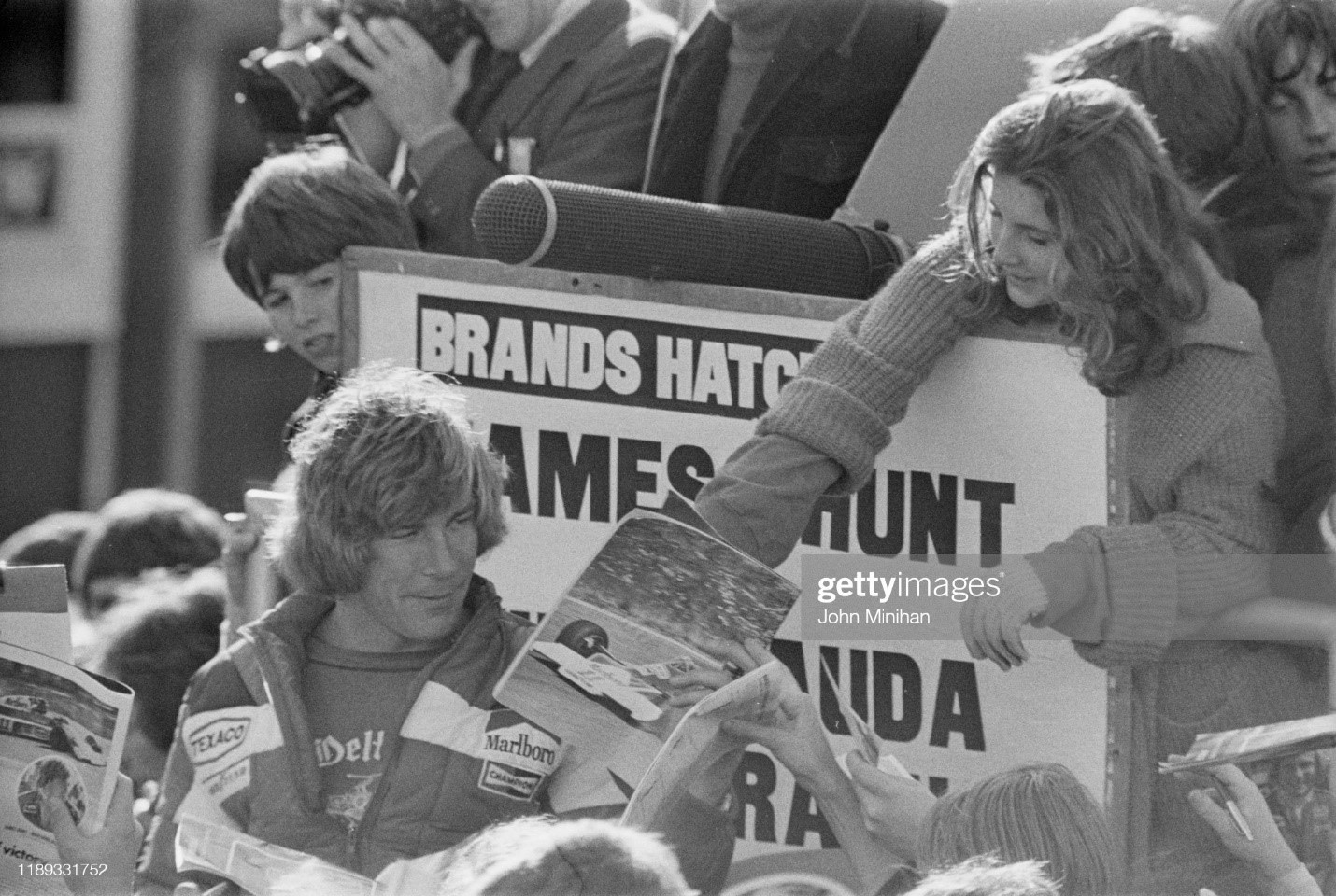 James Hunt signing autographs to fans at Brands Hatch, UK, 07th November 1976. 