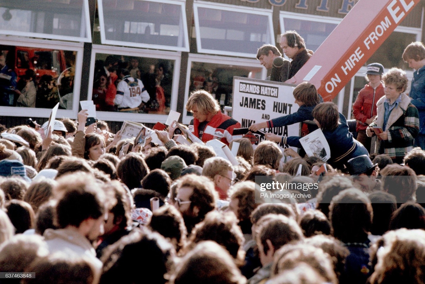 Formula One world champion James Hunt is surrounded by hordes of autograph hunters at Brands Hatch, UK, 07th November 1976. 