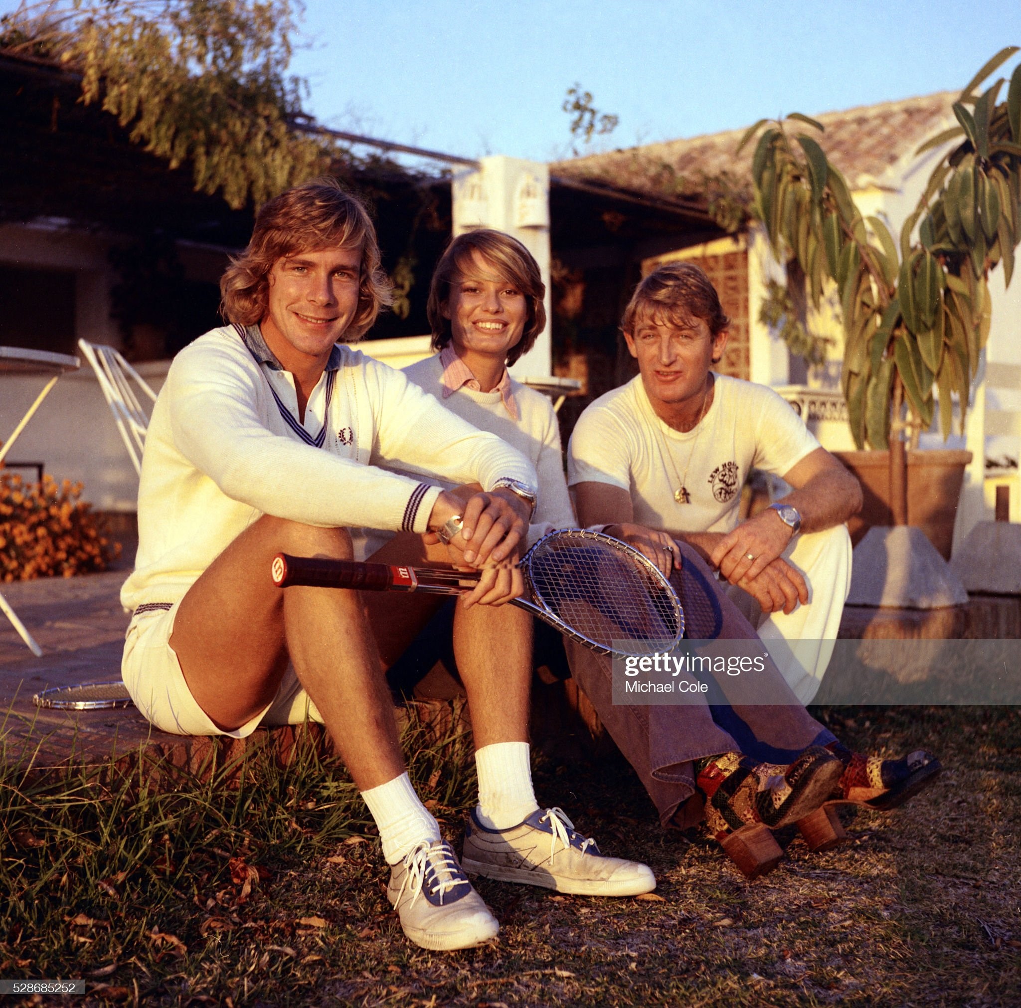 James Hunt and wife Suzy with Lew Hoad at Lew Hoad's 'Campo De Tenis' in Mijas, Spain, December 1974. 