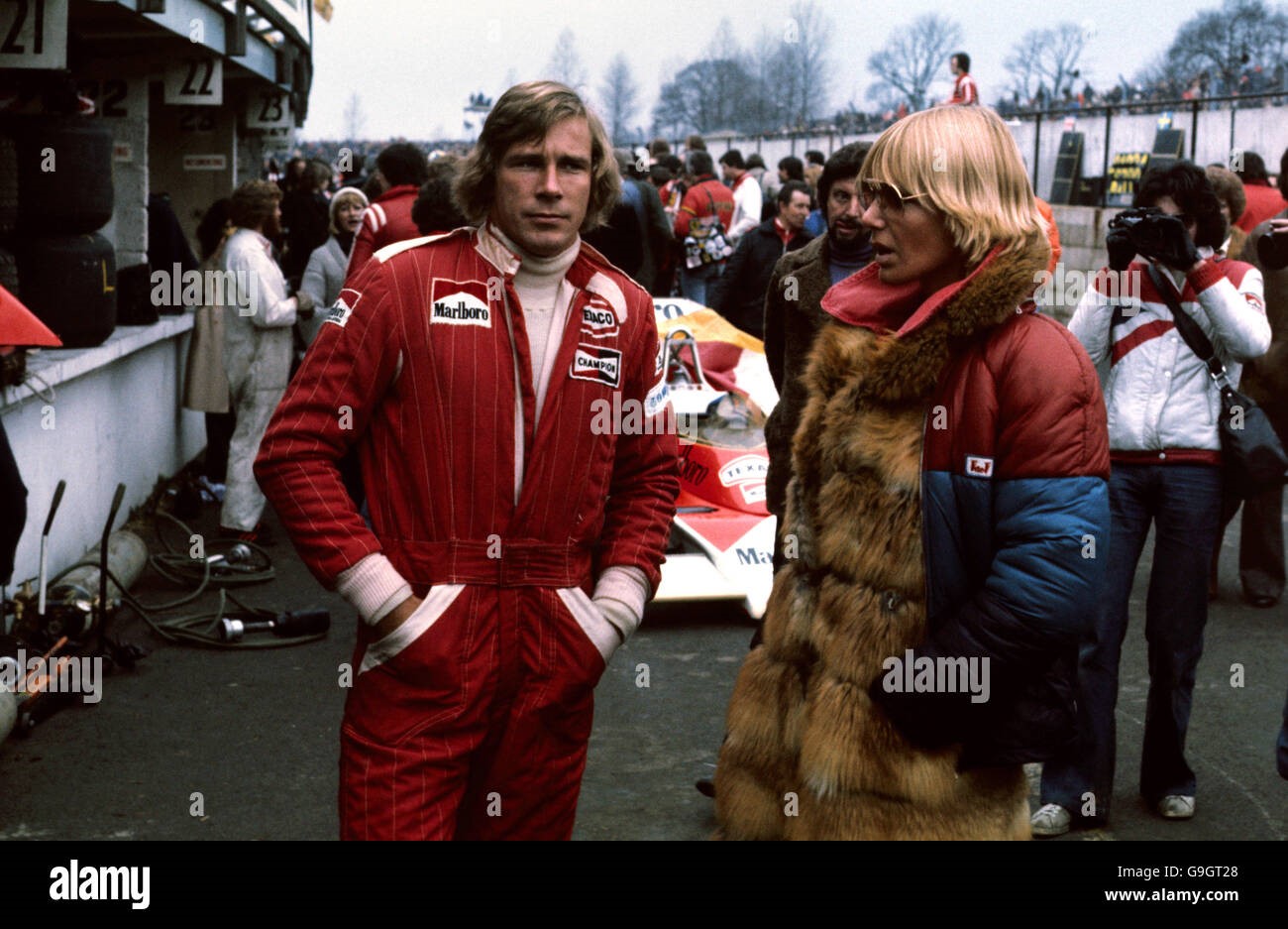 James Hunt talks to Swedish model Venessa Mecklunck in the pits at Brands Hatch on 14 March 1976.