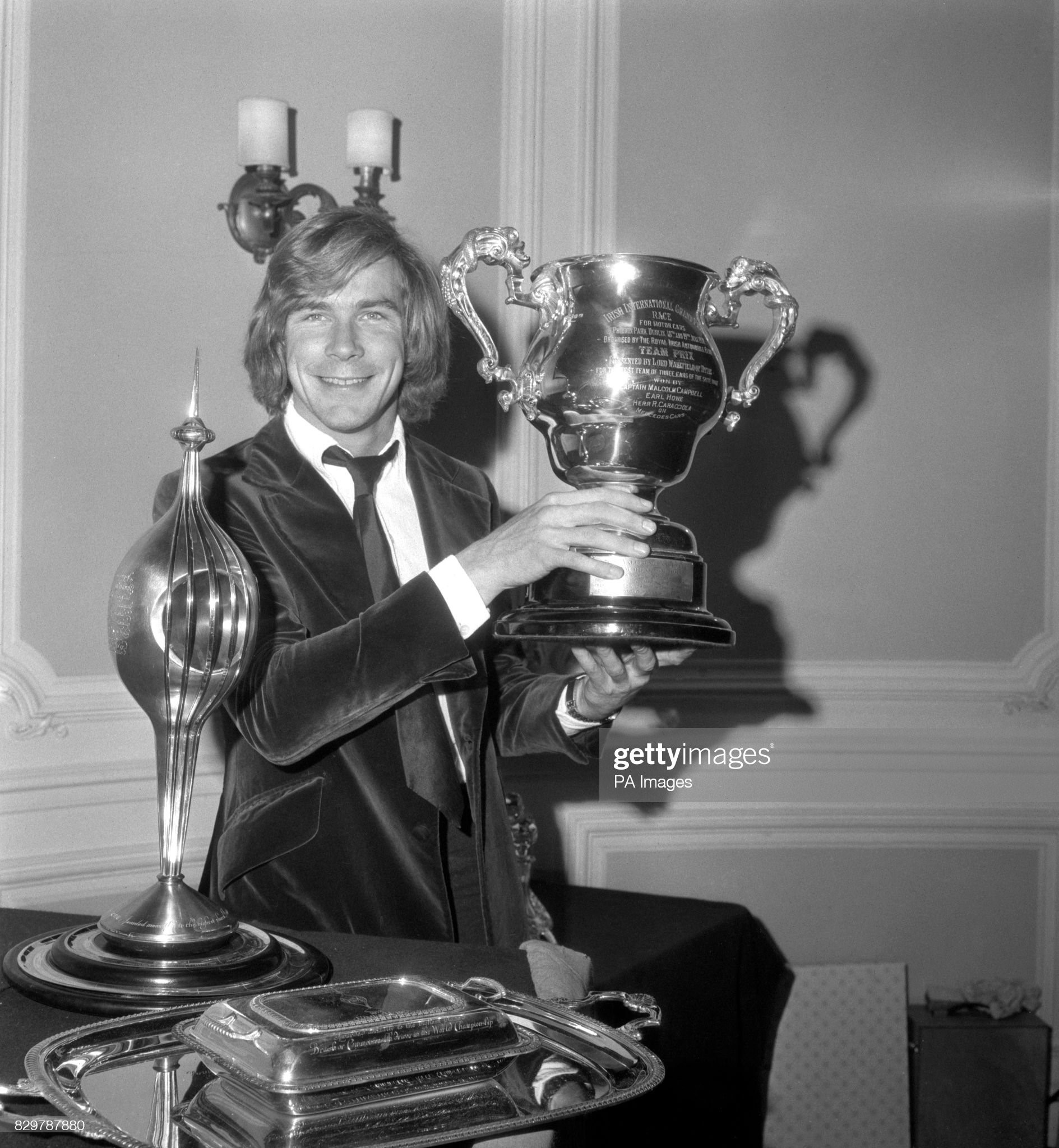 World Champion James Hunt on 03 December 1976 with trophies presented to him at the RAC headquarters in Pall Mall, where he also received a specially struck Rac gold medal as the first English driver to win the World title since Graham Hill in 1968. 