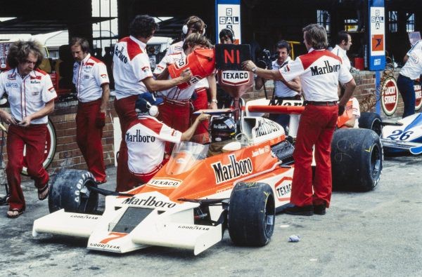 James Hunt waits as his McLaren M26 Ford is refuelled at Kyalami, South Africa, on March 04, 1978.