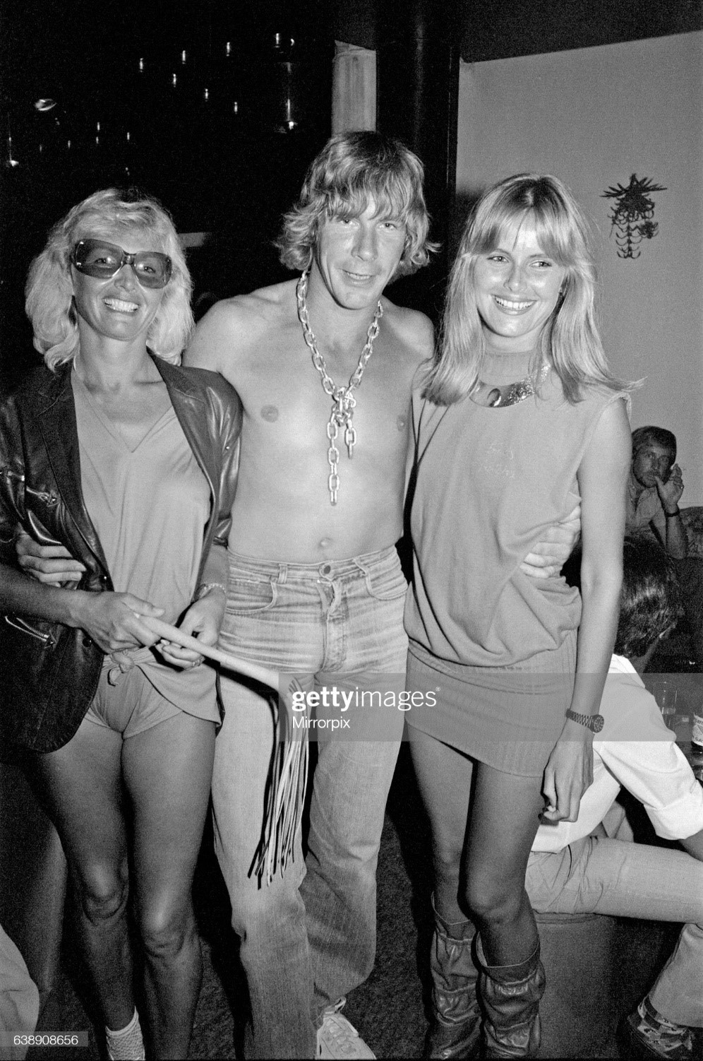 James Hunt with two girls in the night club in Marbella, Spain, that he owns. 