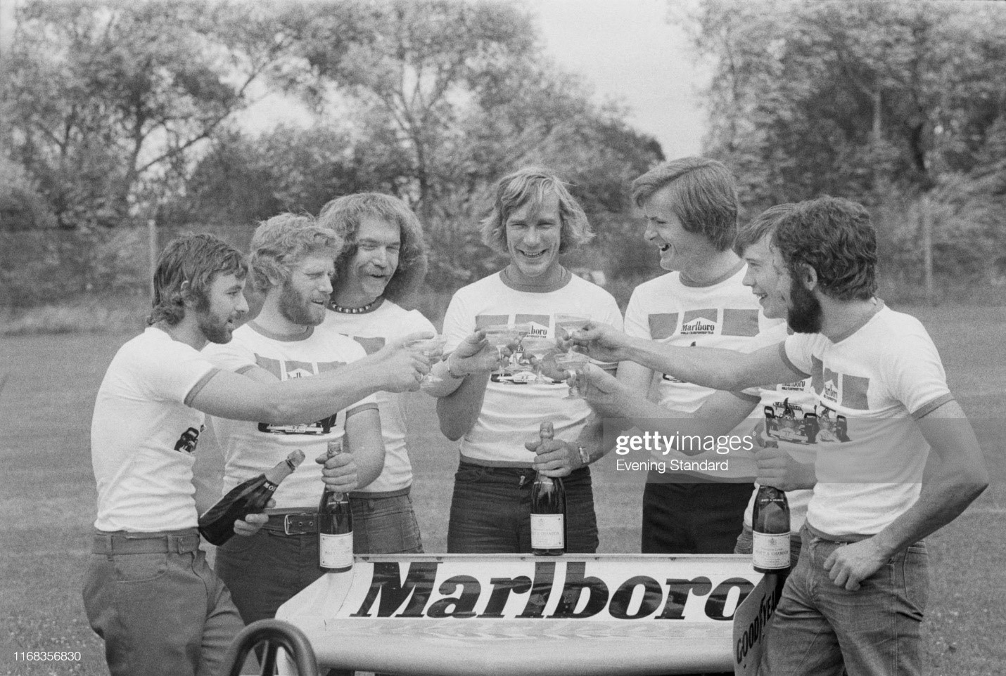 James Hunt with Marlboro Team McLaren (they are: Roy Reader, Mark Scott, Kay Grant, Lance Gibbs, Alastair Caldwell and Howard Moore), UK, 20th July 1976. 