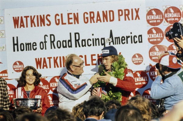 Winner of the US GP James Hunt is interviewed on the podium on 10 October 1976. 