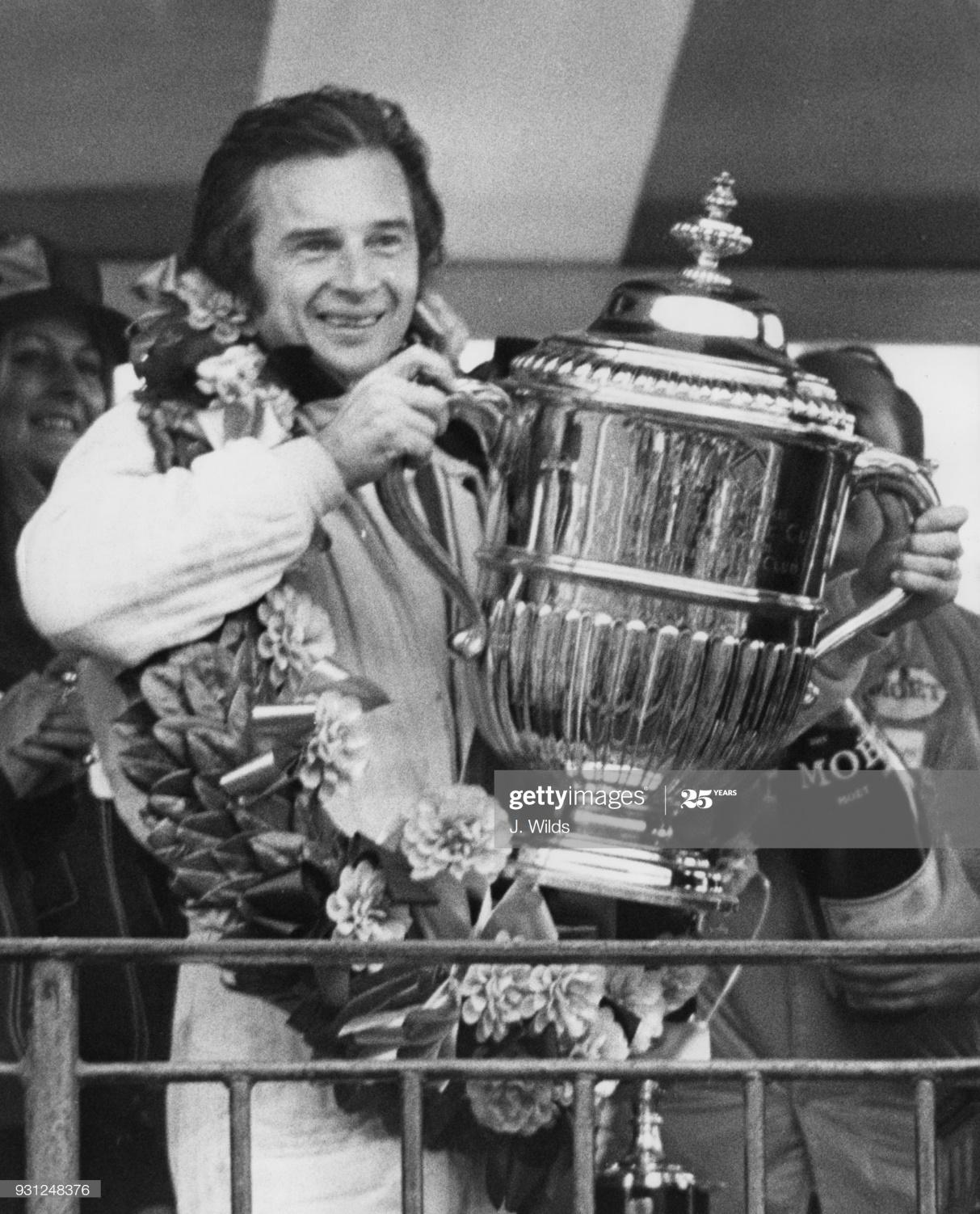 Jean Pierre Beltoise with a trophy.