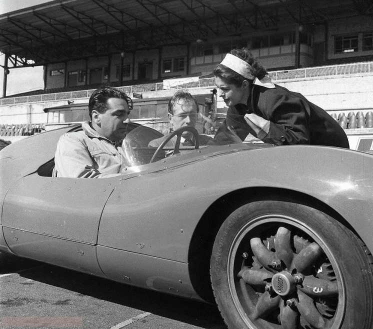 John Cooper in a racing car.