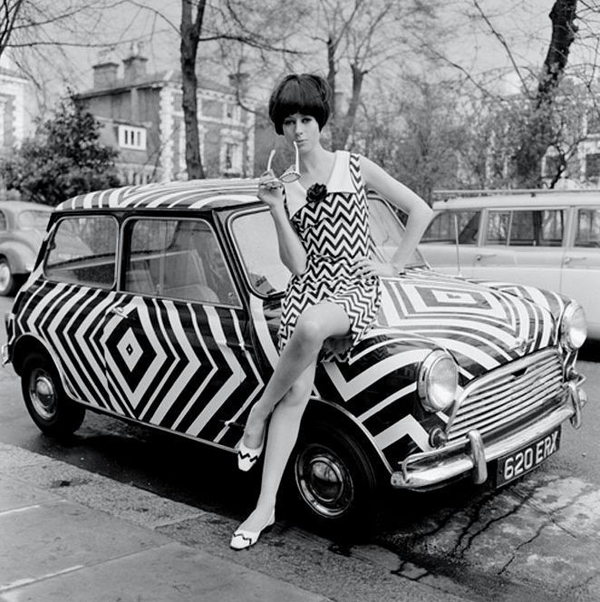 A girl on the Mini that has received the op art treatment in March 1966..