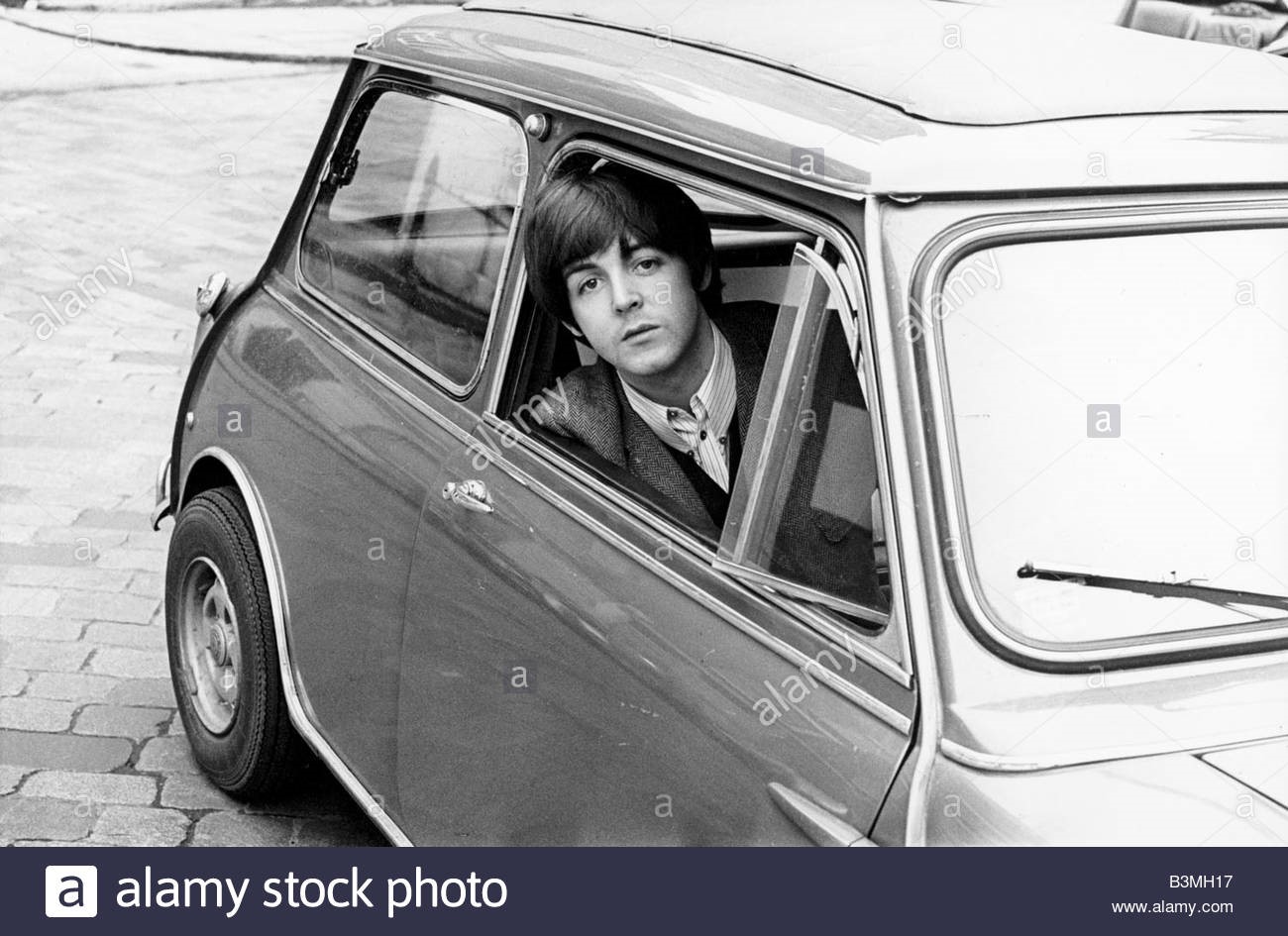 Paul McCartney in his Mini in 1965.