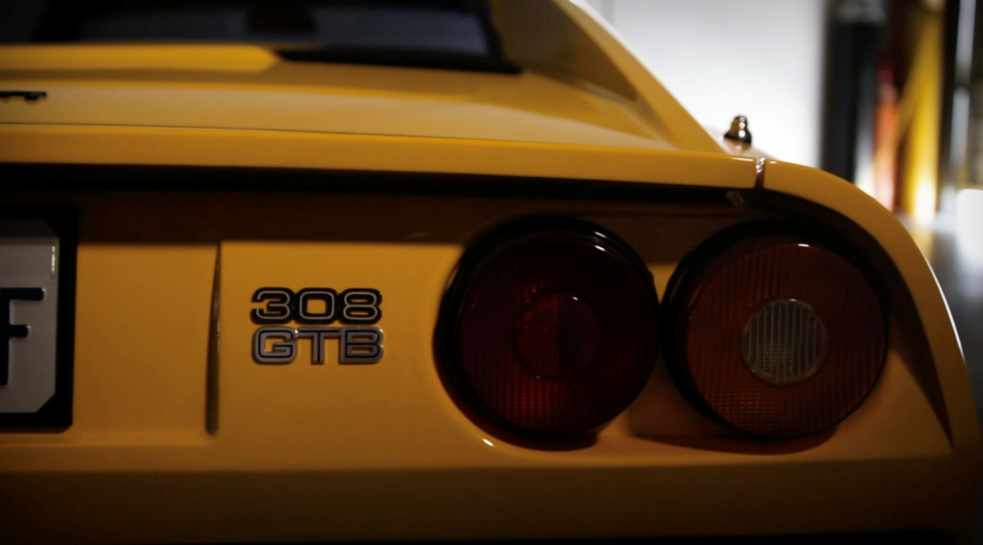 A yellow Ferrari 308 GTB