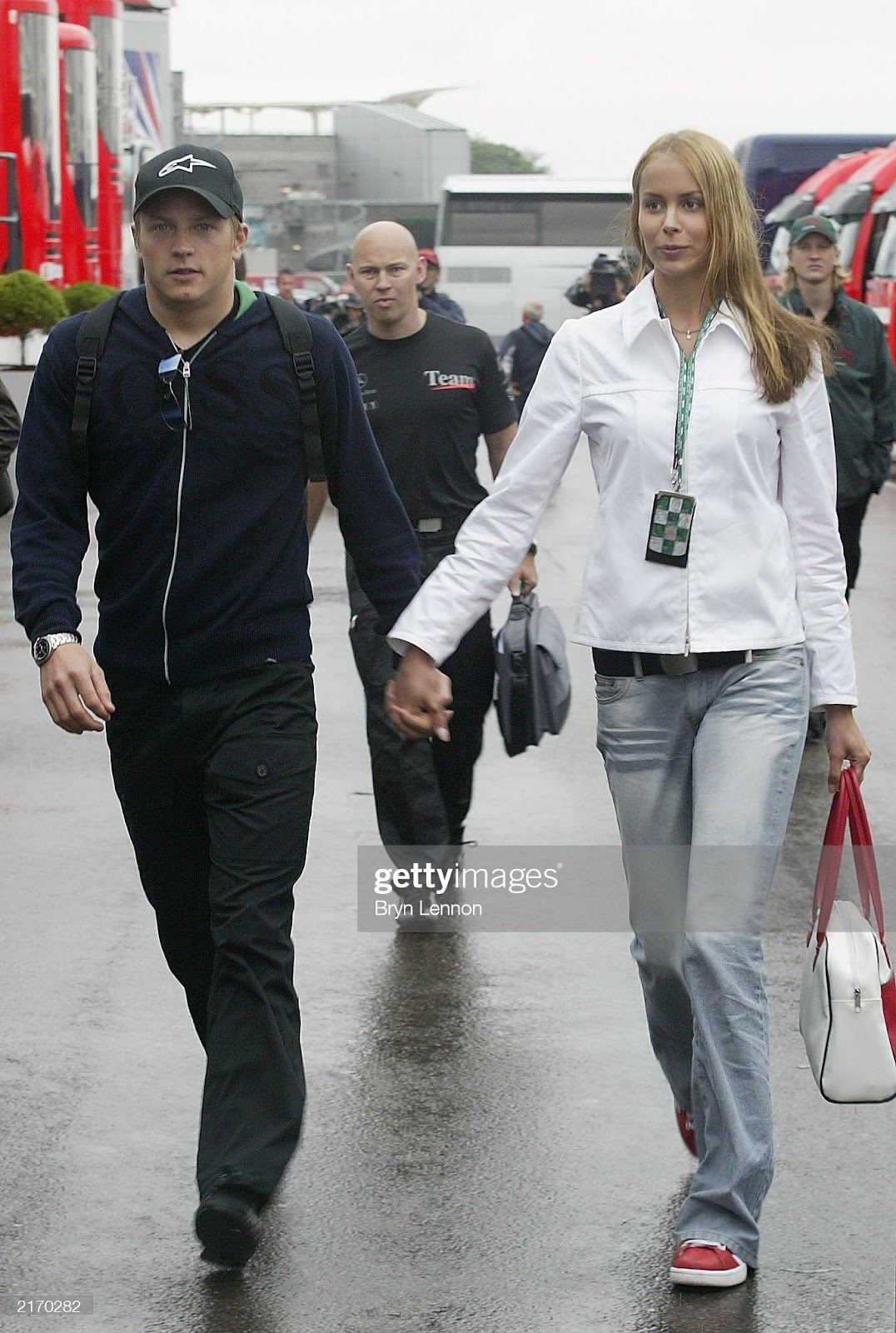 Kimi Raikkonen arrives in the paddock with his girlfriend, Jenni Dahlmann, prior to the Formula One British Grand Prix on July 17, 2003 at Silverstone in Northamptonshire, England.