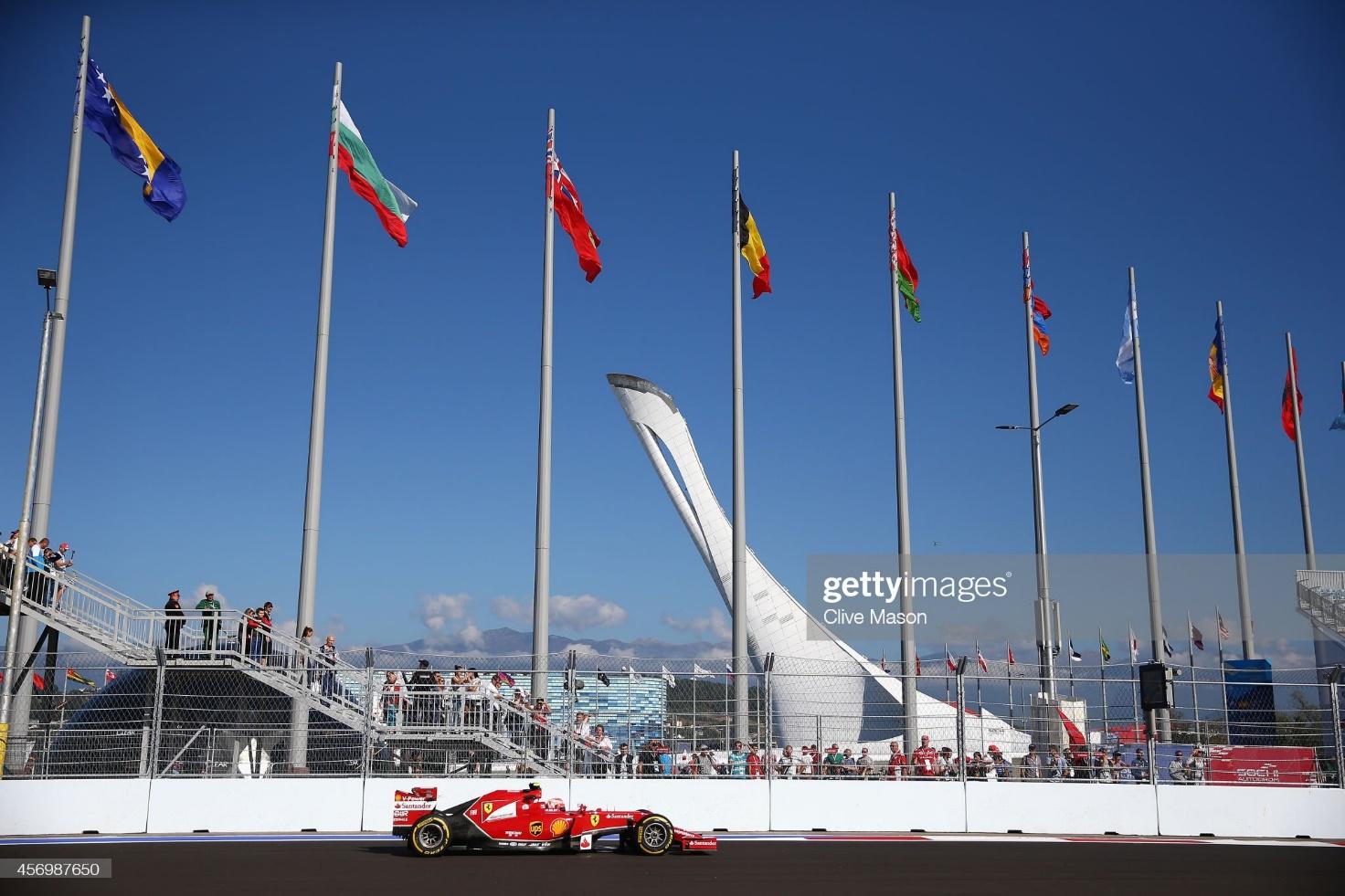 Kimi Raikkonen, Ferrari, drives past the Olympic Cauldron during practice ahead of the Russian F1 Grand Prix at Sochi Autodrom on October 10, 2014.