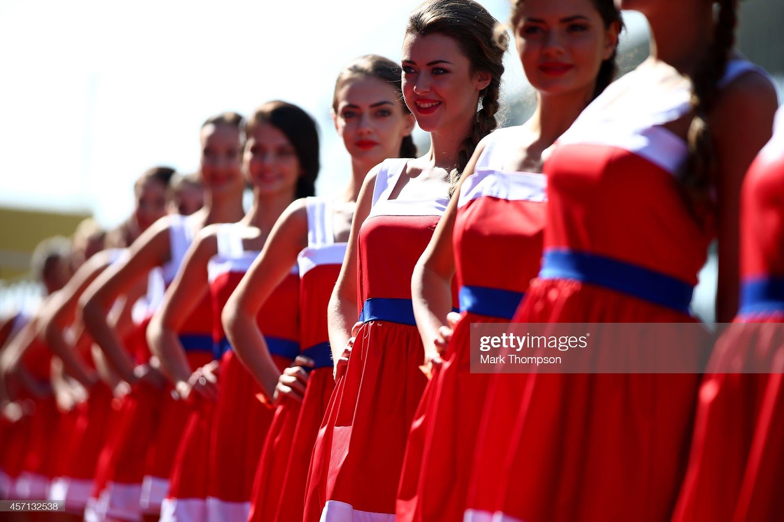 Grid girls pose before the Russian Formula One Grand Prix at Sochi Autodrom on October 12, 2014.