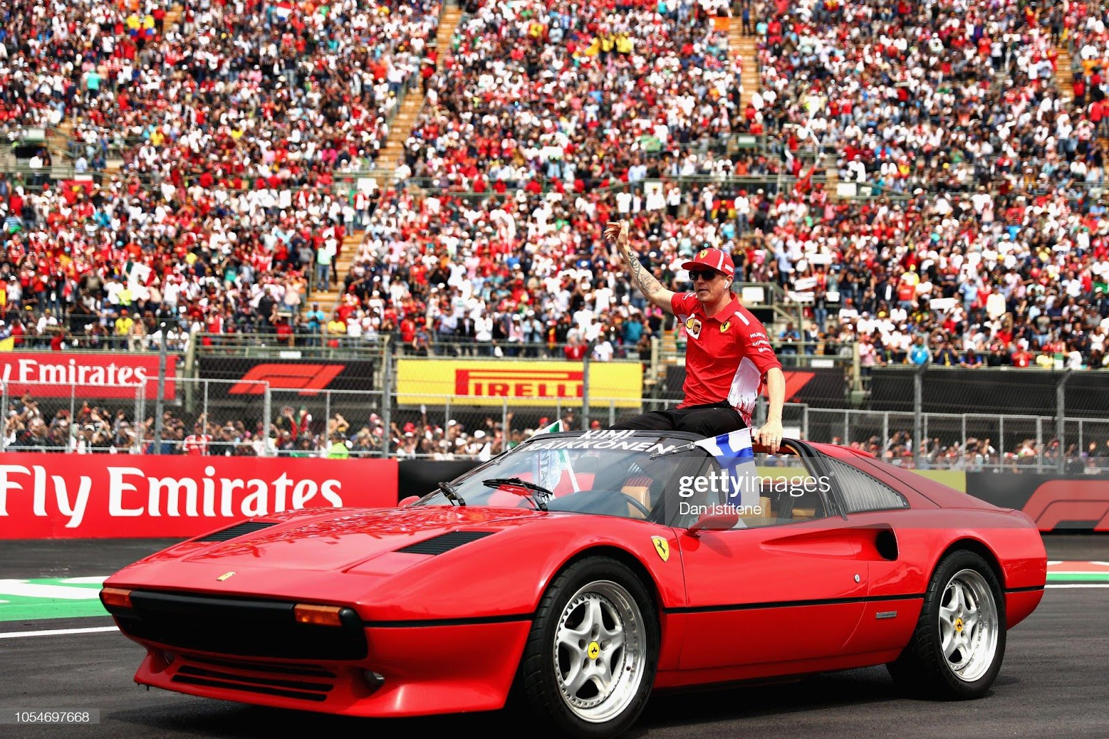 Kimi Raikkonen, Ferrari, waves to the crowd on the drivers parade before the F1 Grand Prix of Mexico at Autodromo Hermanos Rodriguez on October 28, 2018 in Mexico City.