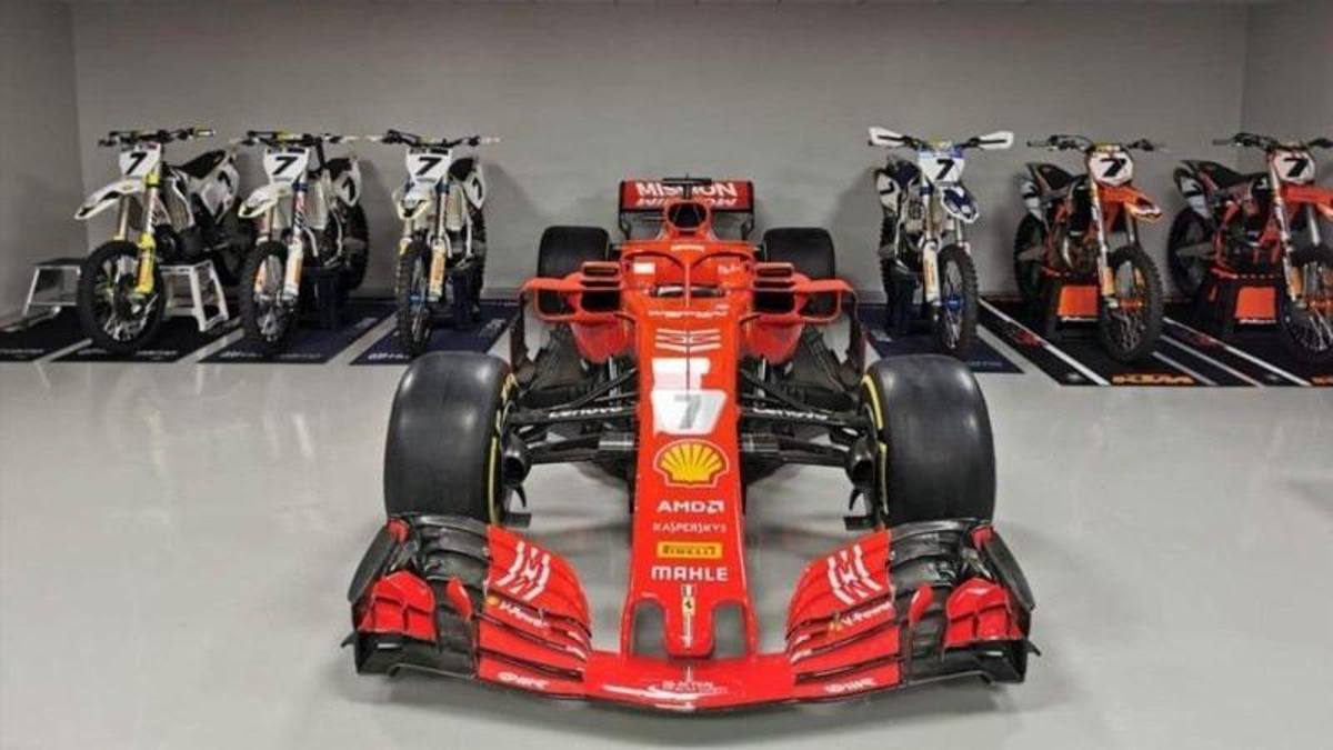 Kimi's garage with a Ferrari F1 and some bikes.