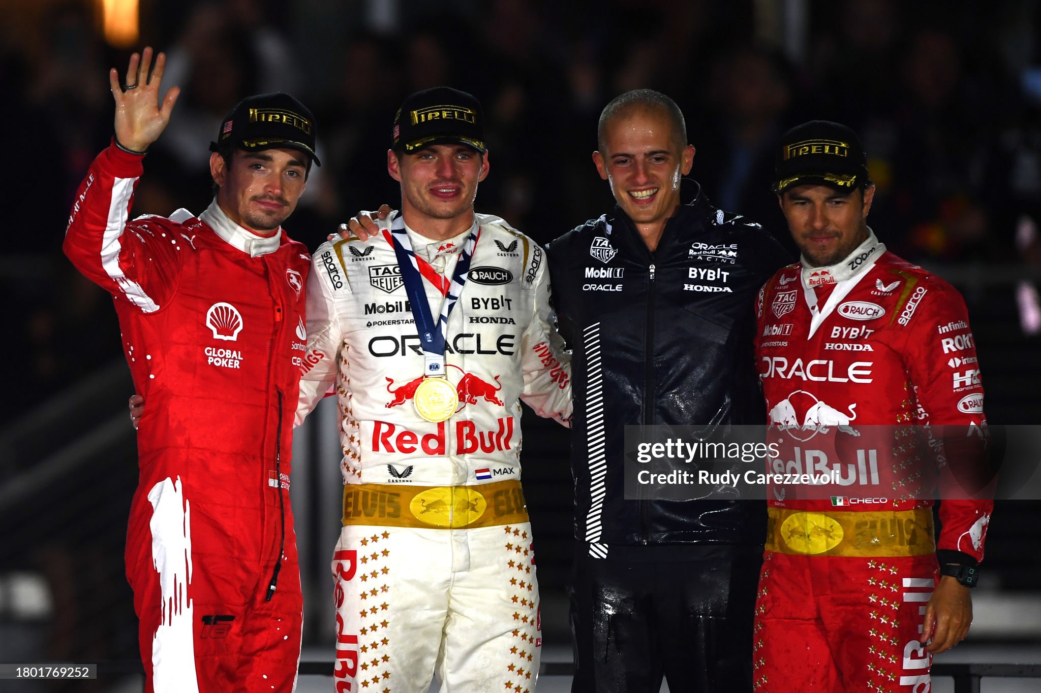 Race winner Max Verstappen of the Netherlands and Red Bull Racing, second placed Charles Leclerc of Monaco and Ferrari and third placed Sergio Perez of Mexico and Red Bull Racing celebrate on the podium during the F1 Grand Prix of Las Vegas at Las Vegas Strip Circuit on November 18, 2023 in Las Vegas, Nevada.