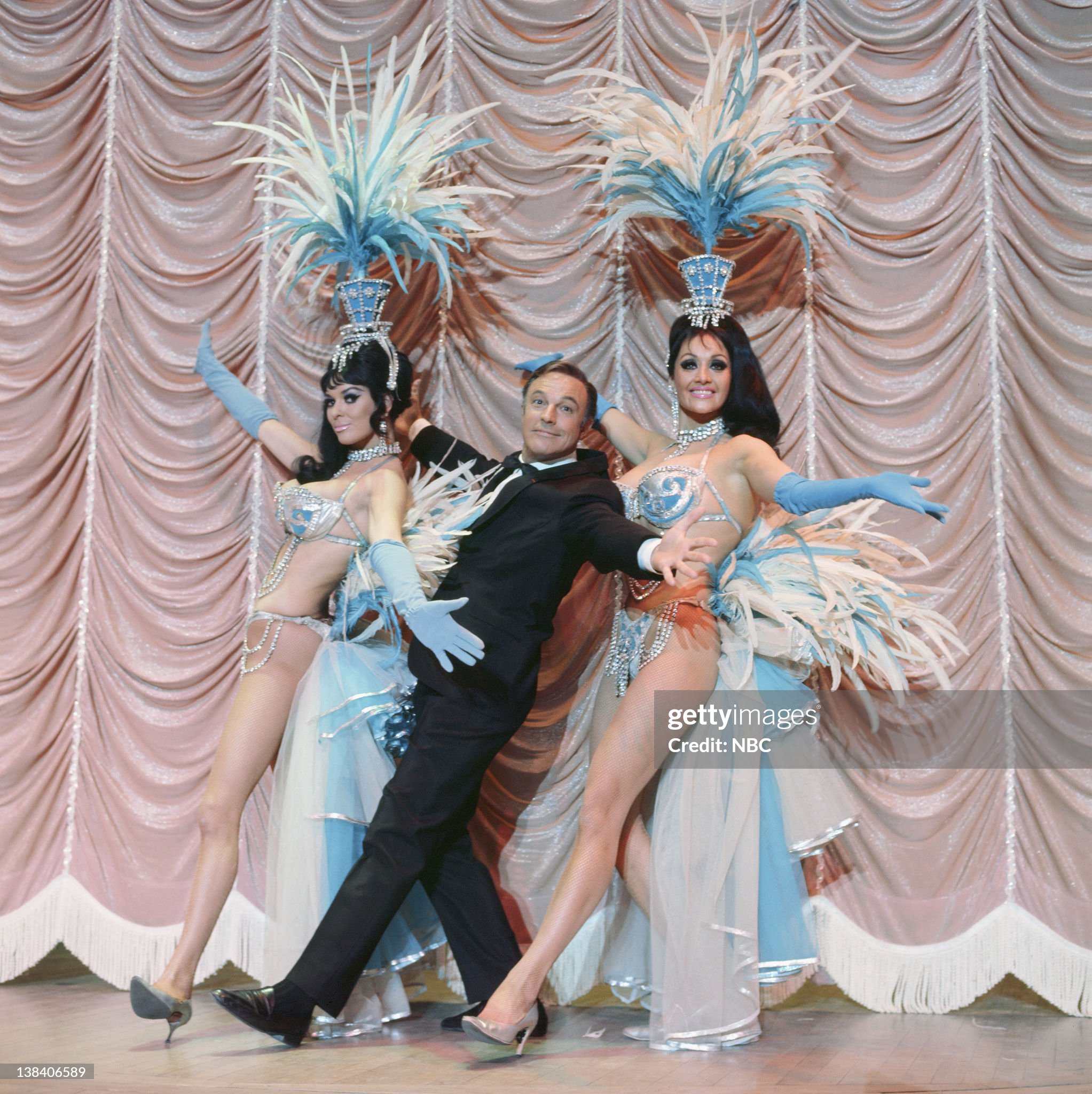 Gene Kelly, center, with the Folies Bergere Showgirls on 14 January 1970. 