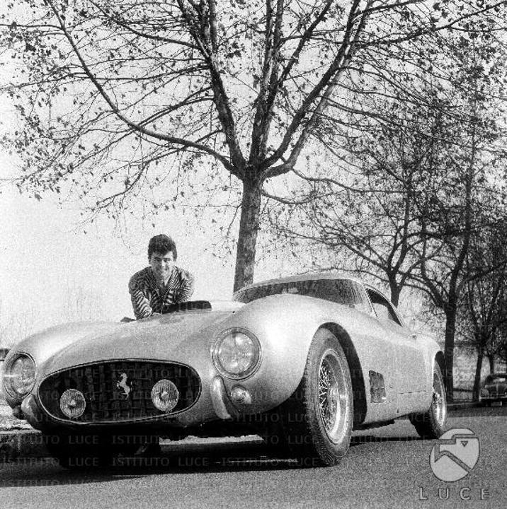 Little Tony in a street in Rome with his Ferrari.