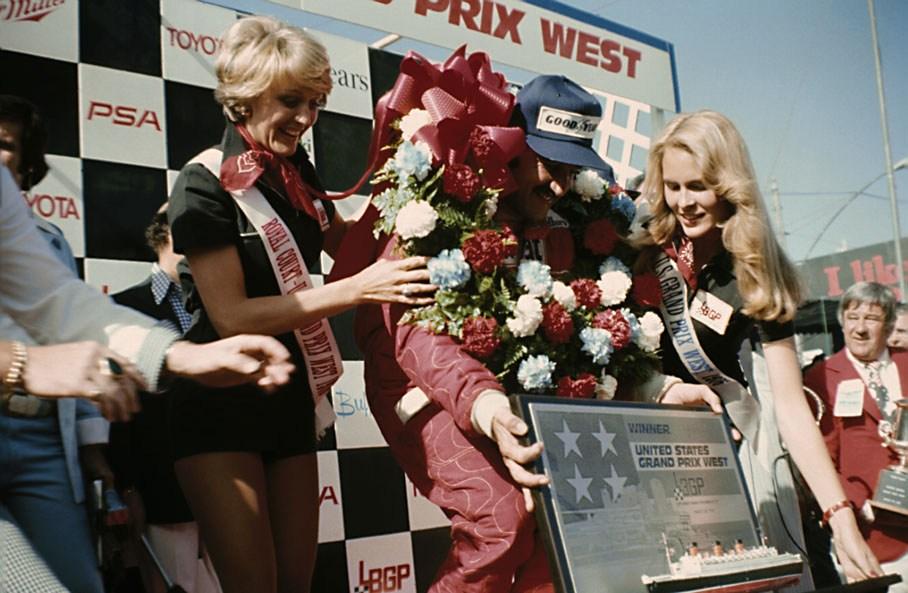 Clay Regazzoni celebrating on the podium at Long Beach in 1976.