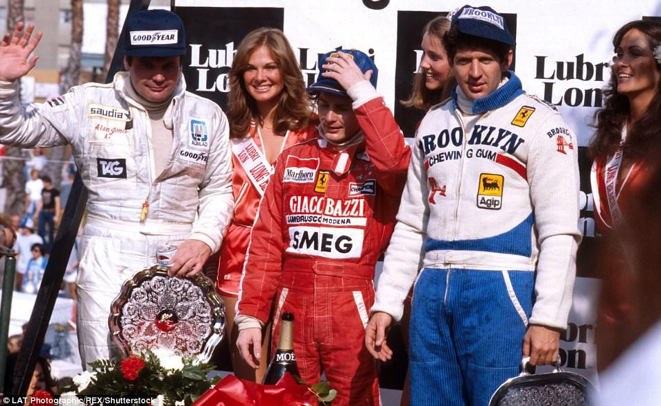 Villeneuve (centre) celebrates his victory on the podium, having triumphed by 30 seconds in front of Ferrari team-mate Jody Scheckter (right) and Williams' Alan Jones.