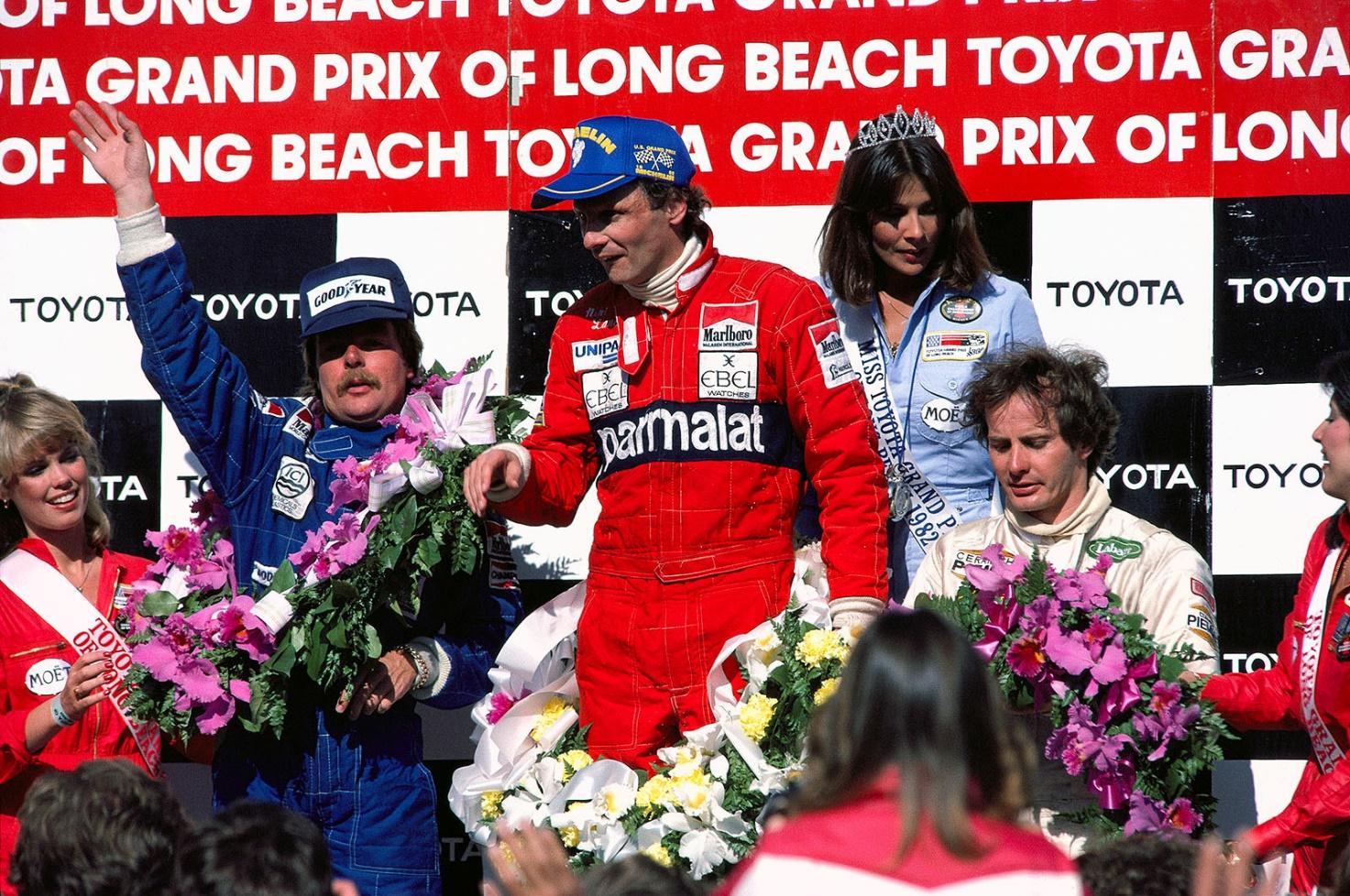 Long Beach 1982. Keke Rosberg, Niki Lauda (middle) and Gilles Villeneuve are the top three drivers on the podium. Lauda won his 1st GP just three races after his comeback in F1 that season.