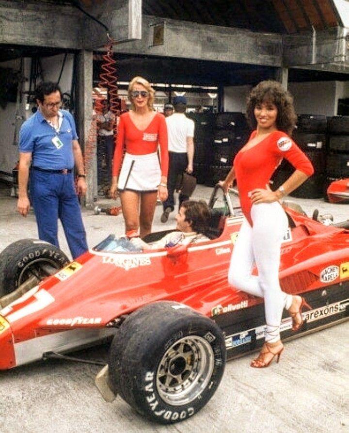 Mauro Forghieri with Gilles Villeneuve in the car and two girls.
