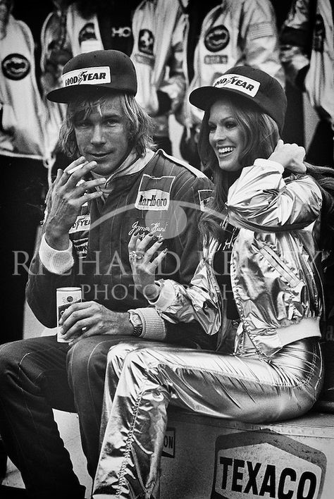 James Hunt, a Schlitz and cigarette in hand and Penthouse Pet by his side, relaxes on his still warm Marlboro McLaren M26 after winning the 1977 United States GP at Watkins Glen.