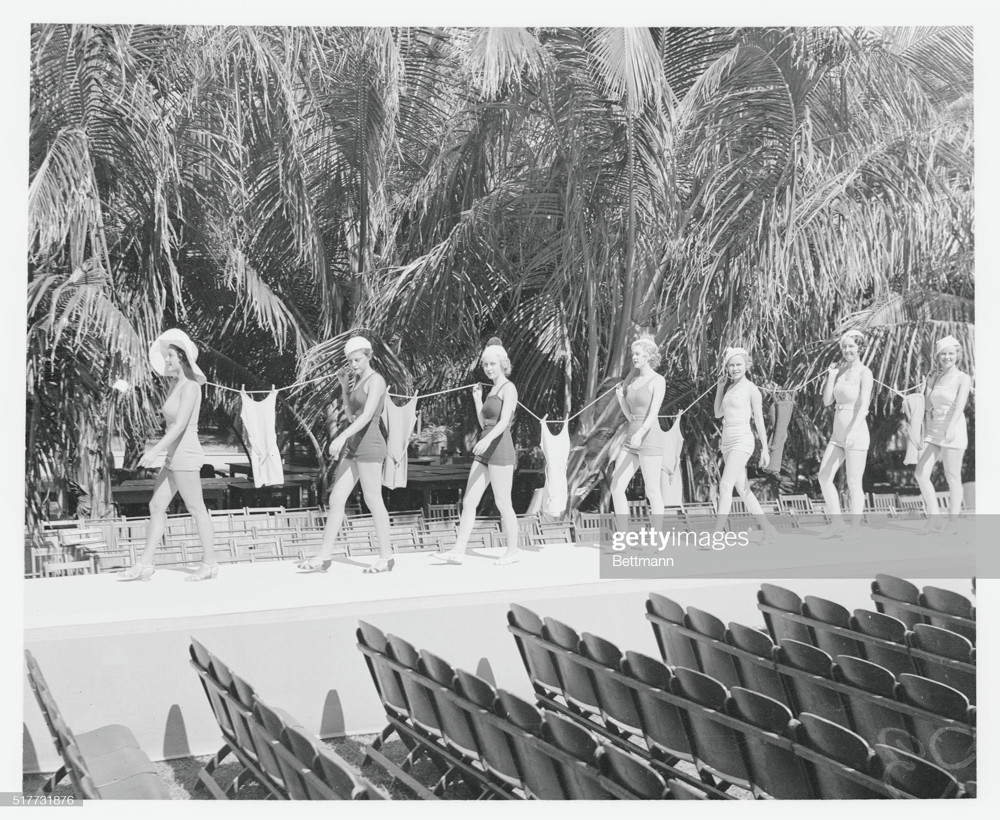 Miami, Florida, February 03, 1933: bathing girls at the Roney Plaza Gardens here believe in being prepared for an emergency keeping an extra suit handy. The Gardens are a popular rendezvous among the society folk who are gathered here for the fashionable mid-winter season. 