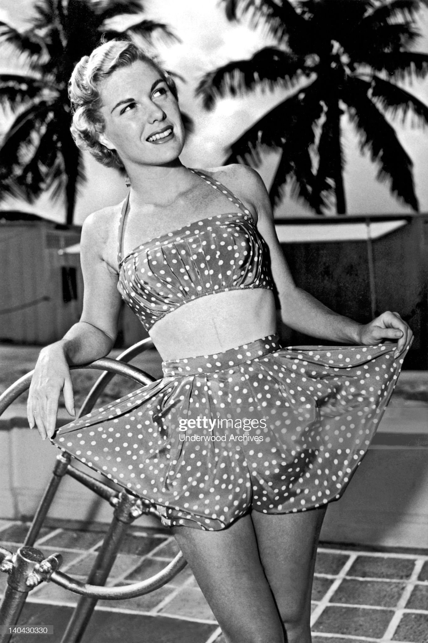 Baby rompers bounce onto the beach fashion scene for big girls, Miami Beach, Florida, February 24, 1950. Designed by Garbar, they are polka dotted pure silk.